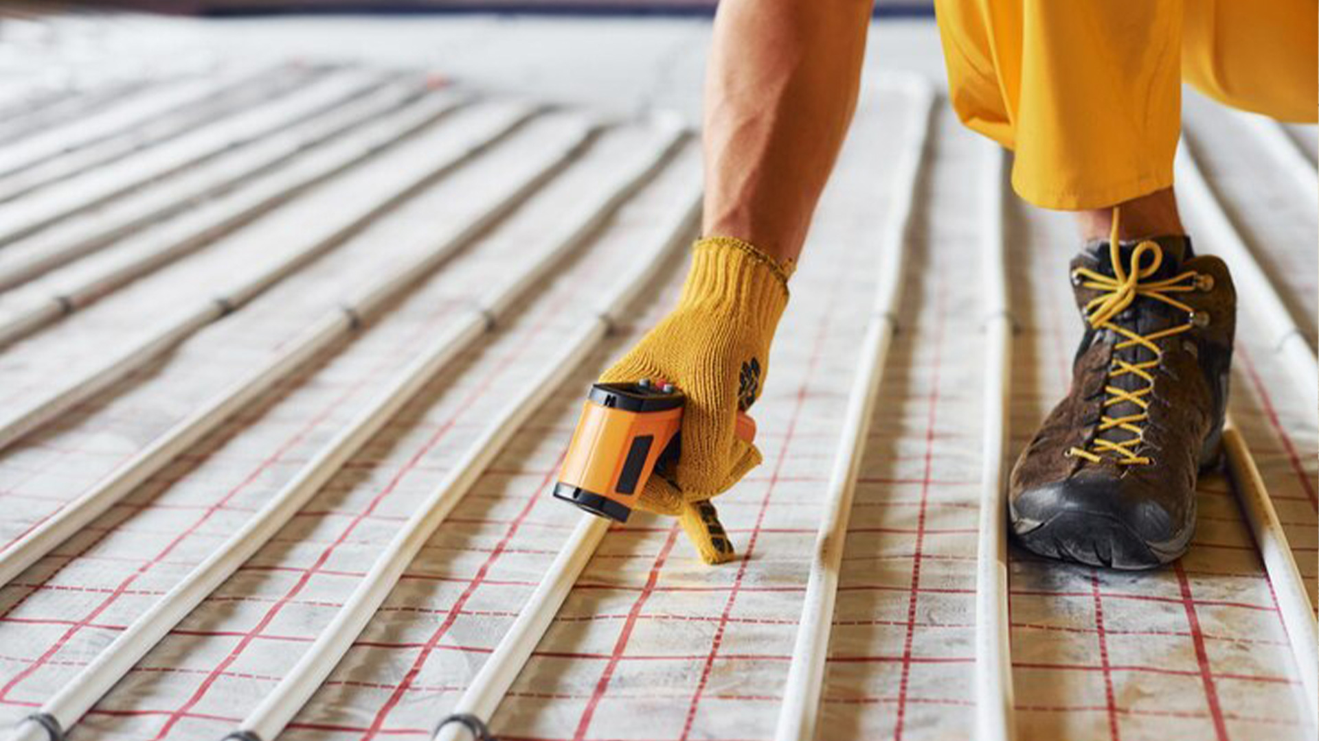 HVAC Contractor at Woods Heating And Cooling installing floor heat in custom home in Speafish, SD.