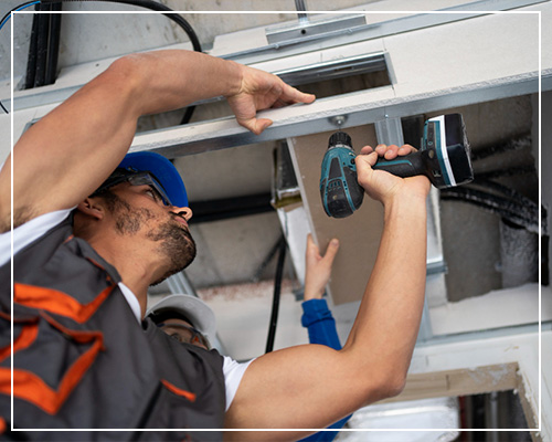 HVAC contractor installing duct work and heater in custom home in new construction HVAC services in Spearfish, SD.